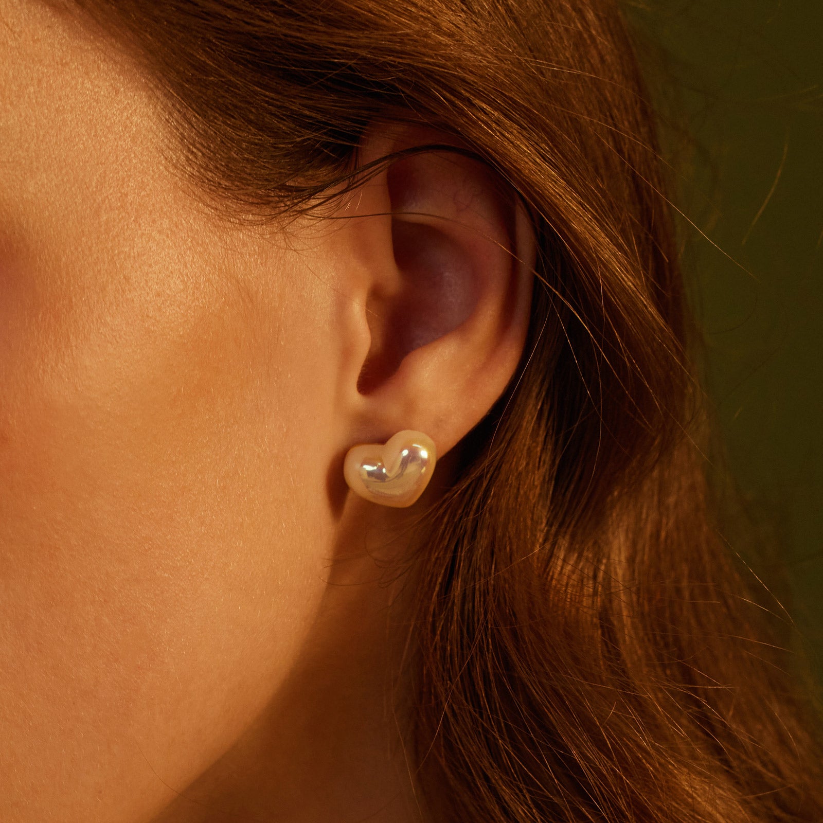 Heart-shaped Stud Earrings, a versatile and stylish pair that effortlessly complements your everyday look with a hint of romance