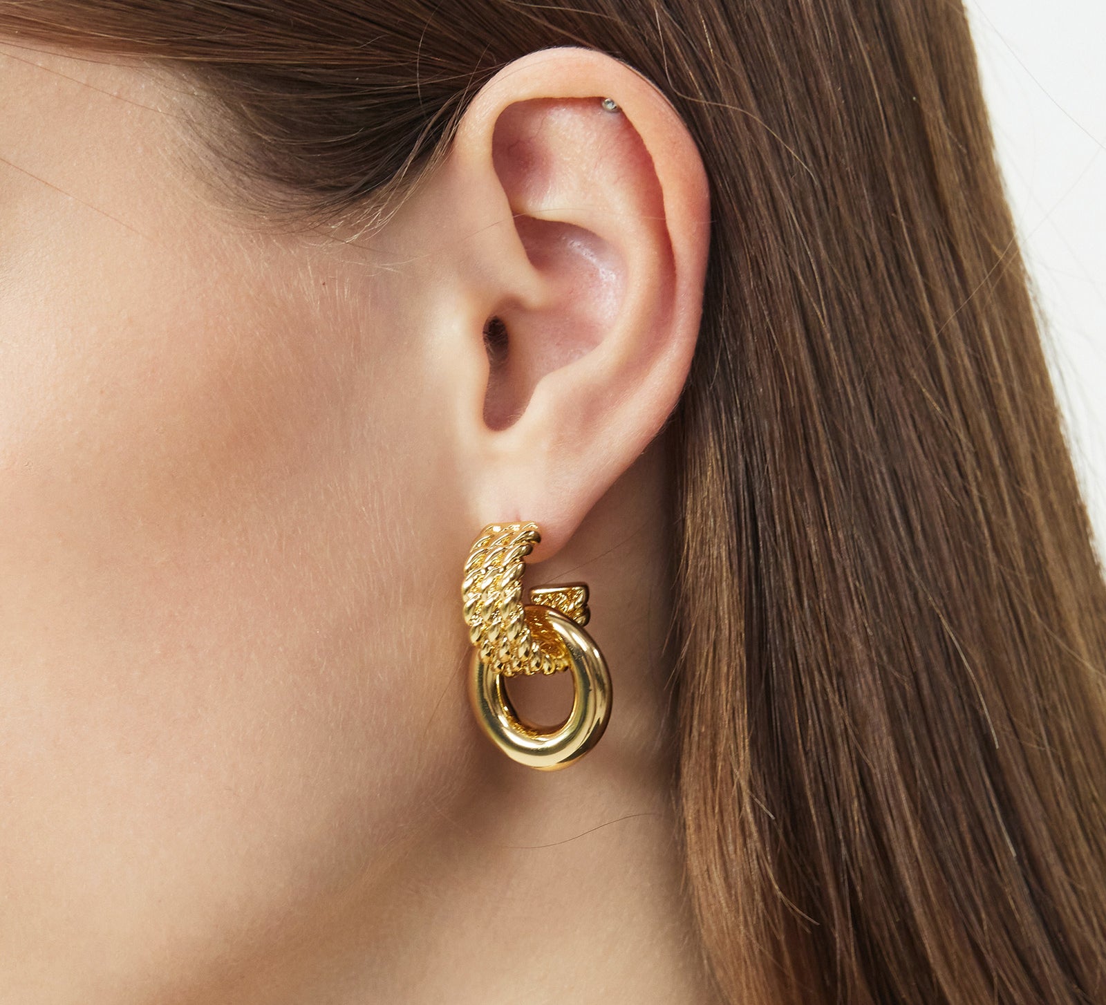 Ring Entwine Chunky Earrings with sculpted gold details, these earrings provide a unique and artistic charm, capturing attention with their intricate design