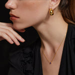 Gold Dome Hoop Earrings, capturing the essence of a radiant golden halo for a glamorous and sophisticated look