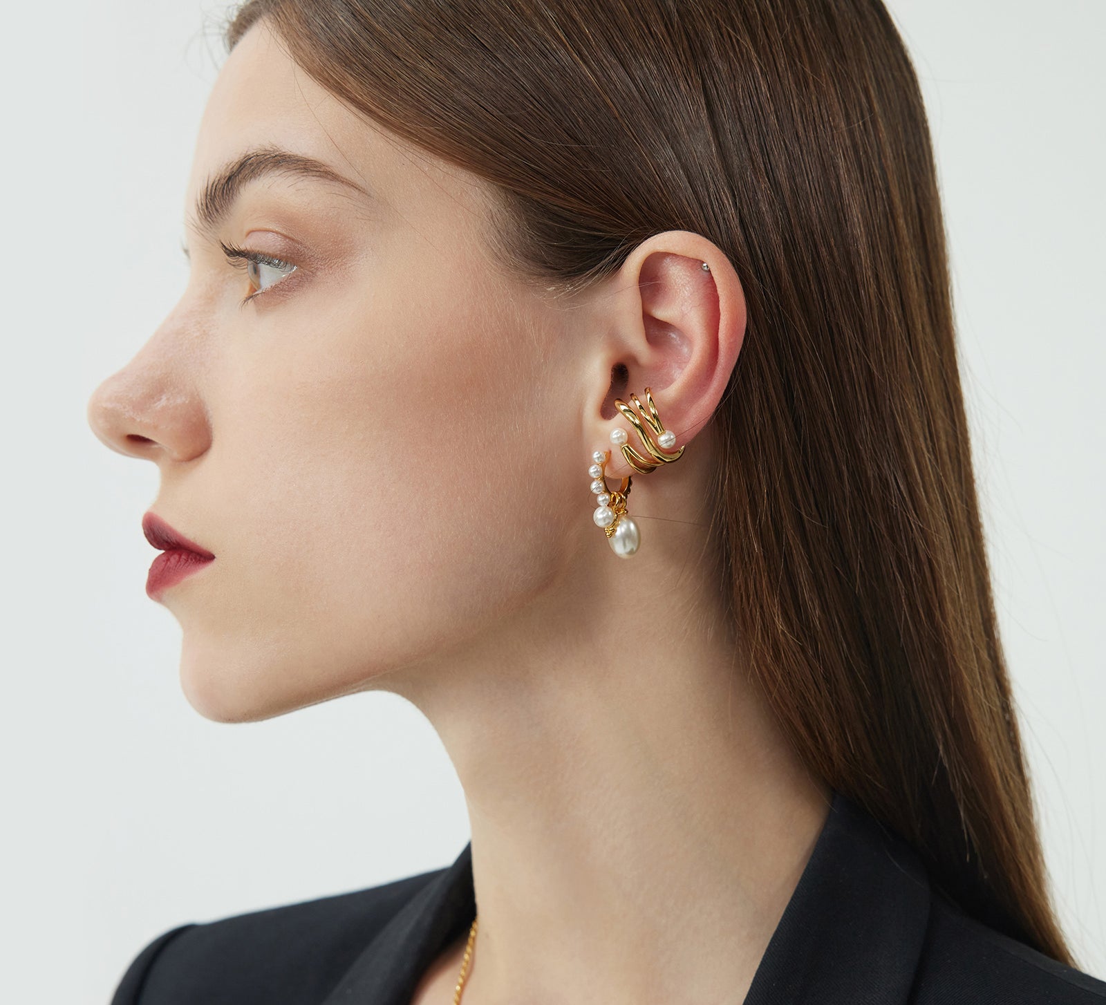 Gold Pearl Huggie Hoops, featuring a lustrous display of pearls against a golden backdrop, adding a touch of opulence and sophistication to your ear ensemble