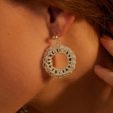 Flower Entwine Earrings, designed to emulate nature's embrace, these hoops showcase a delicate entwining of flowers, creating a romantic and elegant accessory for any occasion