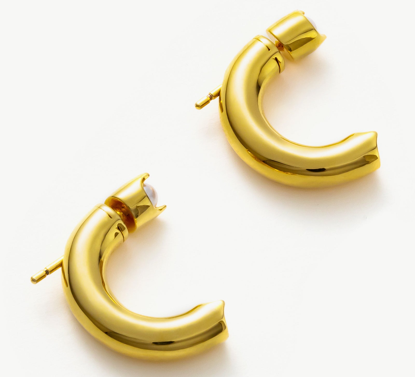 Gold Mini Hoop Earrings, showcasing gleaming gold tones in a mini design, perfect for a subtle and elegant statement.