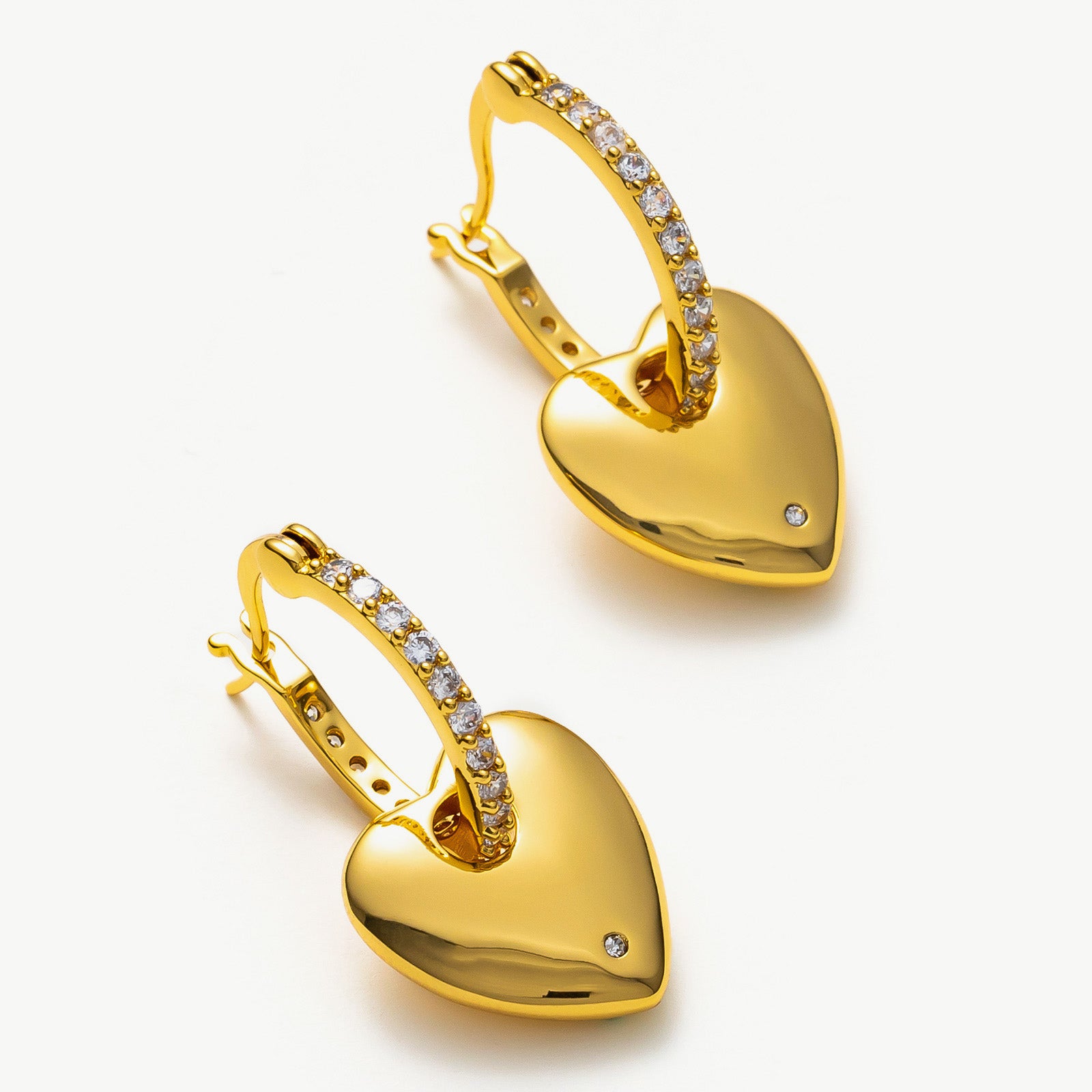  Hoop Earrings with golden heart and crystal charms, a whimsical and romantic choice that adds a touch of playfulness to your ensemble
