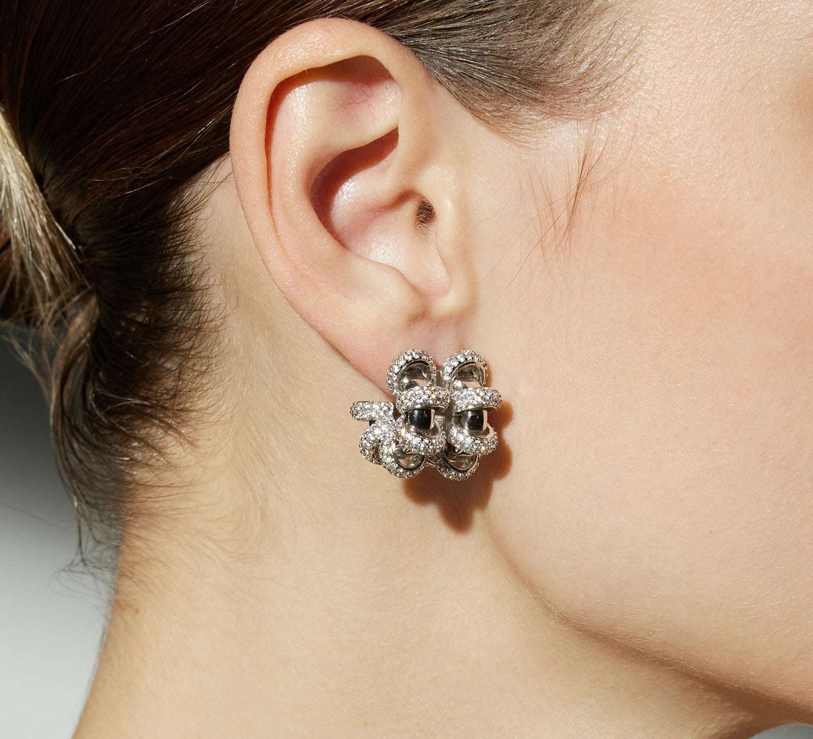 Coiled Double Earrings with sculptural twists, these earrings make a bold and artistic statement, capturing attention with their unique and eye-catching design.