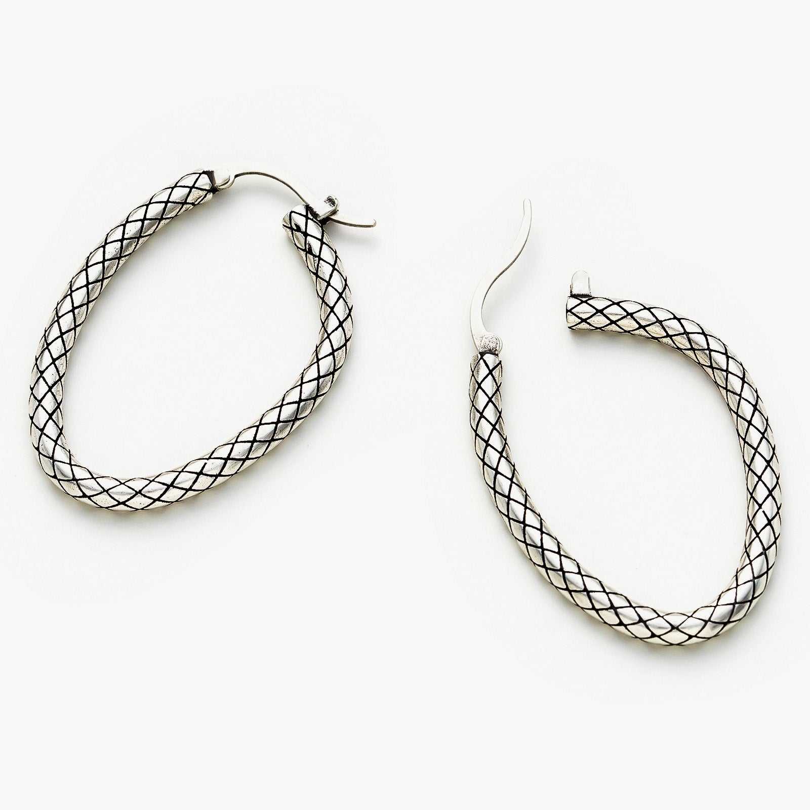 Front Facing Hoop Earrings, showcasing a sculptural and frontal perspective for a distinctive and fashionable addition to your jewelry collection