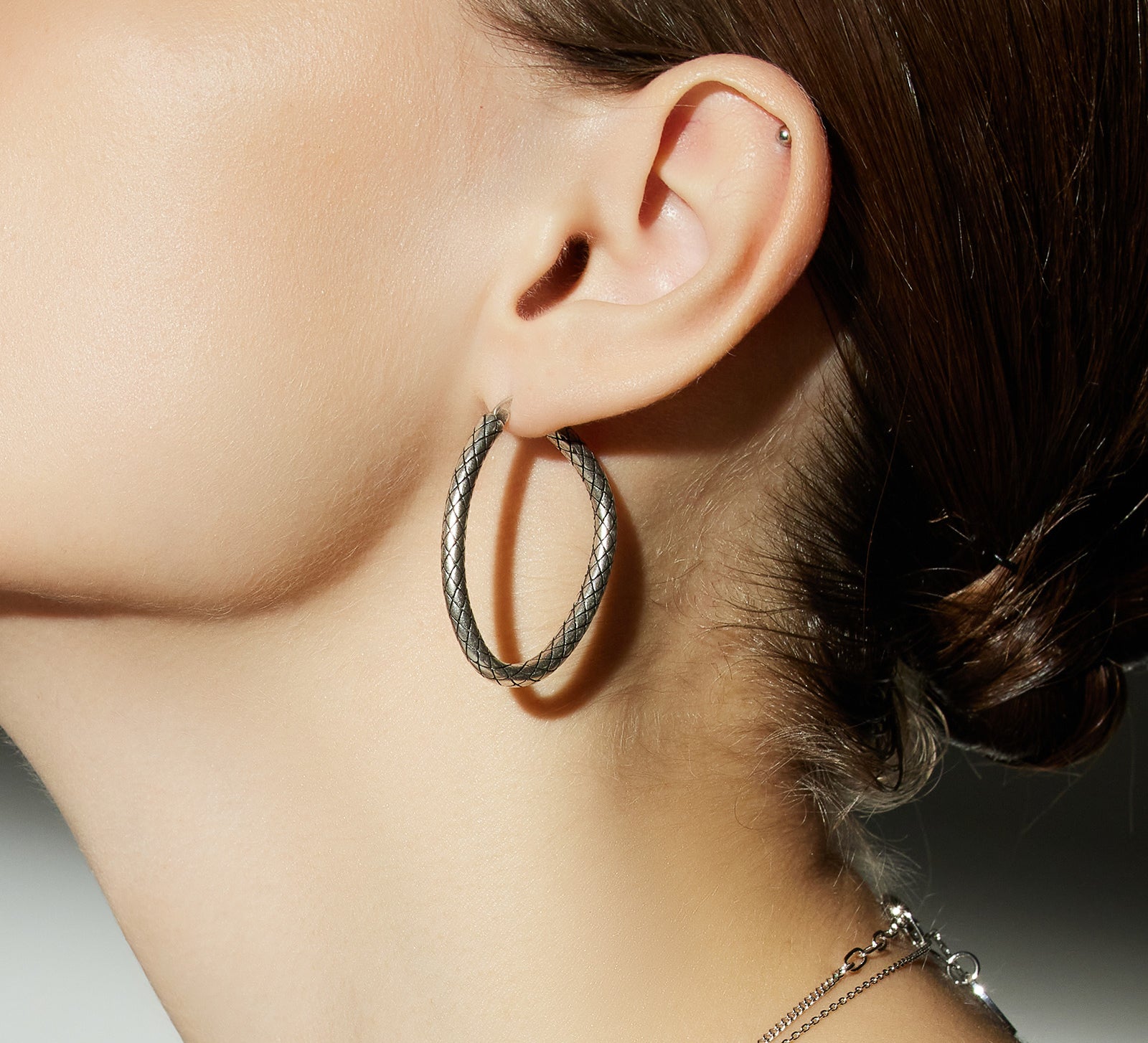 Hoop Earrings with a front-facing flair, a bold and unique style statement that captures attention with its distinctive and eye-catching design