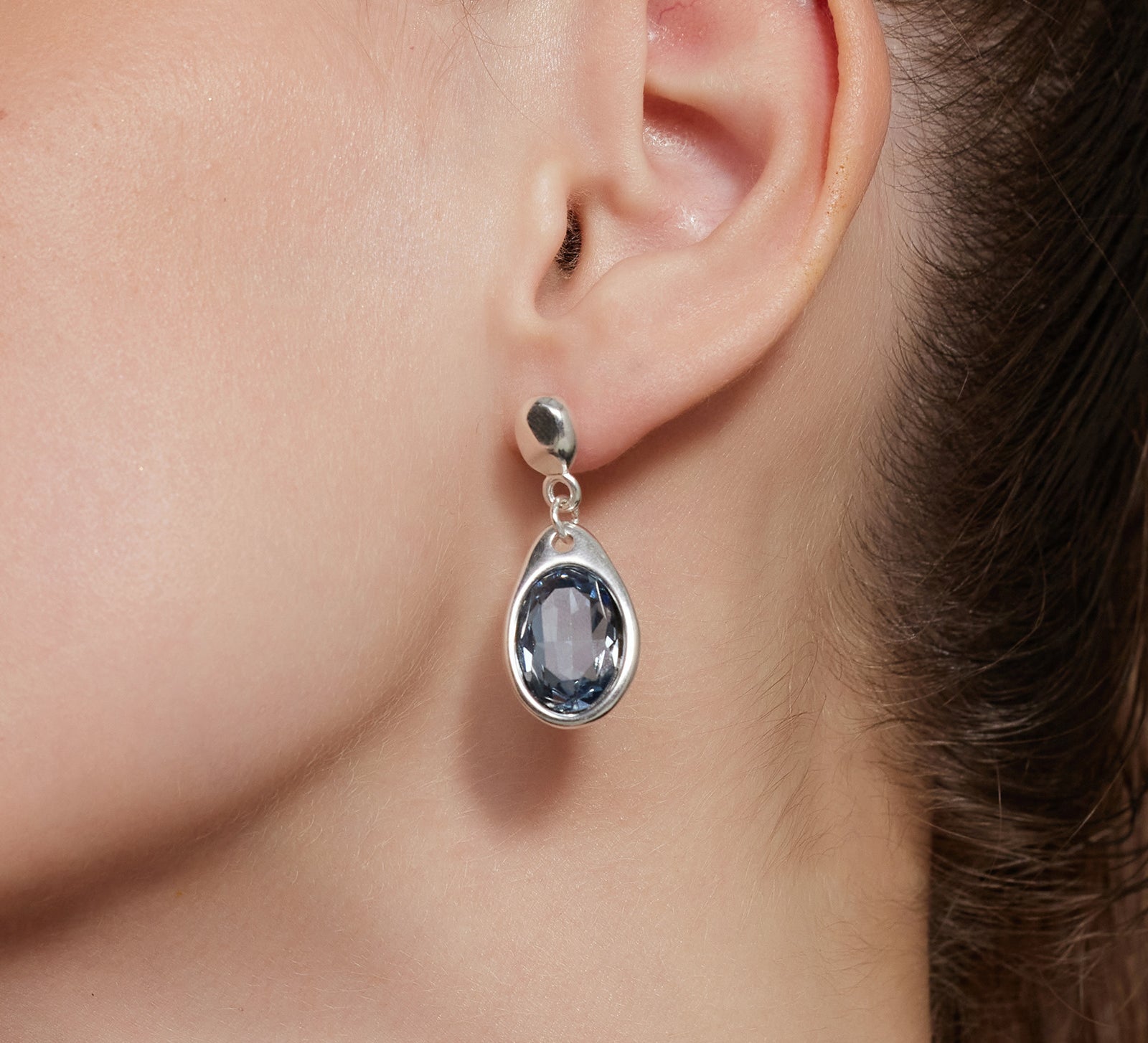 Large Dove Grey Crystal Drop Hoops with a cascade of crystals, these earrings bring a glamorous and sparkling element to your ensemble, making a bold fashion statement