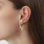Gold Ear Cuff adorned with a pearl, a statement accessory that exudes sophistication and glamour