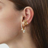 Gold Ear Cuff adorned with a pearl, a statement accessory that exudes sophistication and glamour