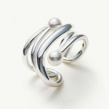 Silver Ear Cuff adorned with a pearl, a statement accessory that exudes modern sophistication and charm