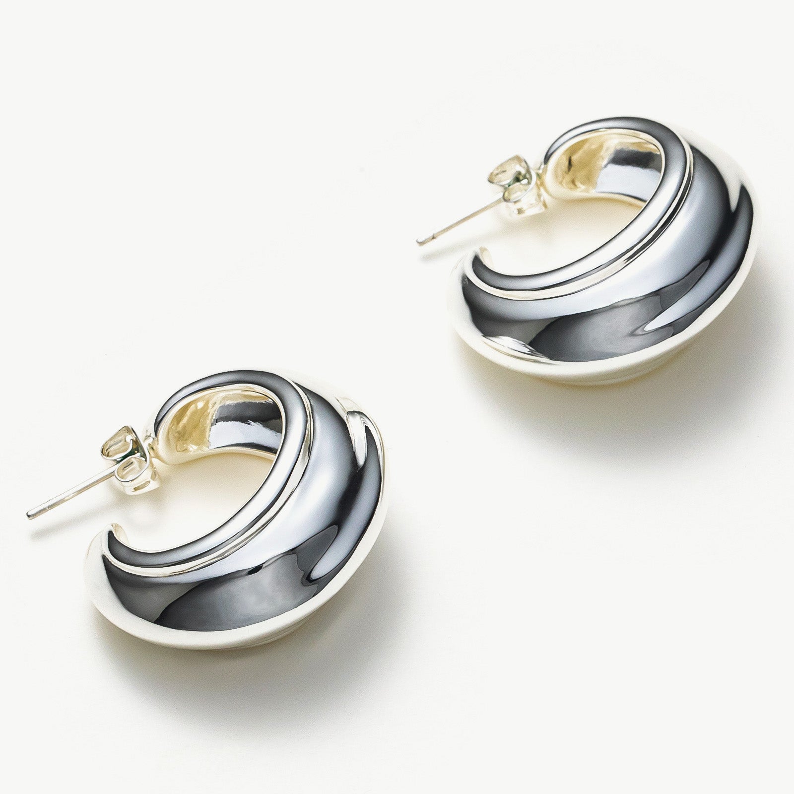 Ridge Hoop Earrings with a chic appeal, these hoops bring a touch of trendiness to your style, making them a fashionable and eye-catching choice for your jewelry collection.