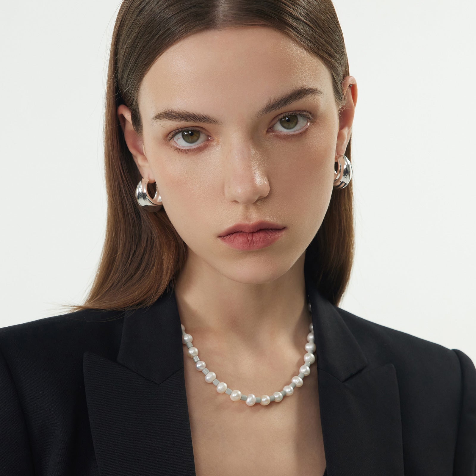 Ridge Hoop Earrings, adorned with a contemporary ridge charm, these earrings blend modernity with sophistication, creating a versatile and fashionable accessory.