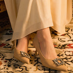 Elegant-beige-pumps-crafted-from-leather_-featuring-stunning-embellishments-for-a-refined-and-glamorous-look
