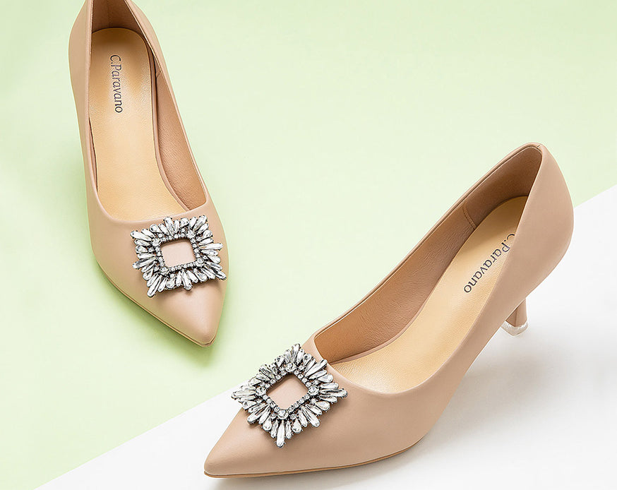    Elegant-beige-pumps-crafted-from-leather_-featuring-stunning-embellishments-for-a-refined-and-glamorous-look