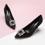 Elegant-black-pumps-crafted-from-tweed_-featuring-stunning-embellishments-for-a-refined-and-glamorous-look