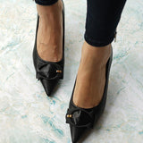 Elegant-black-pumps-with-C-shaped-buckle-detailing_-adding-a-touch-of-sophistication-and-style-