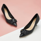 Elegant-black-pumps-with-C-shaped-buckle-detailing_-adding-a-touch-of-sophistication-and-style