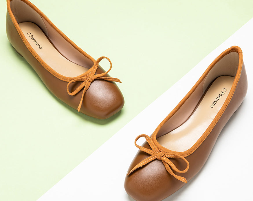Elegant-brown-ballerina-flats-adorned-with-a-dainty-and-refined-bowknot.