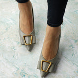 Elegant-green-pumps-featuring-buckles_-adding-a-touch-of-sophistication-and-style