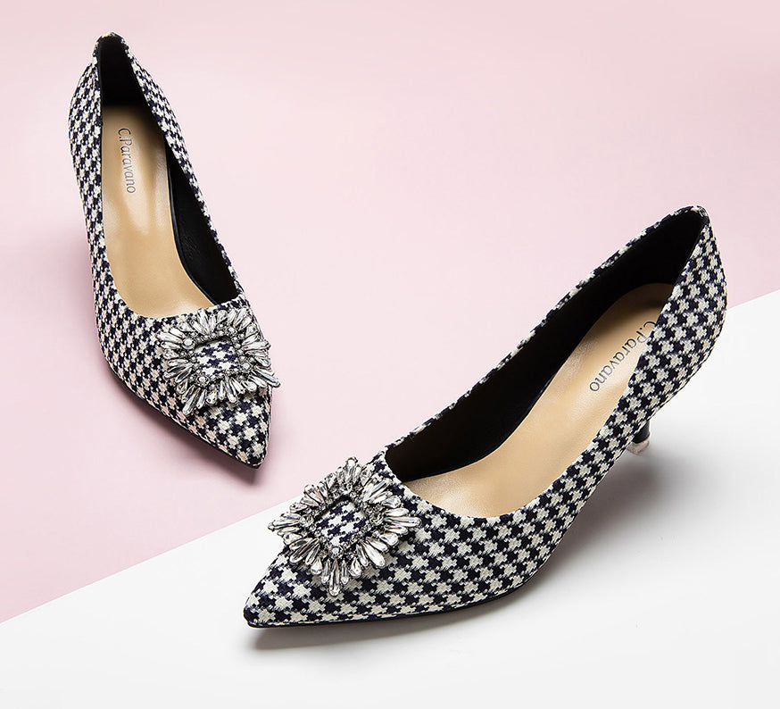 Elegant-houndstooth-pumps-crafted-from-tweed_-featuring-stunning-embellishments-for-a-refined-and-glamorous-look