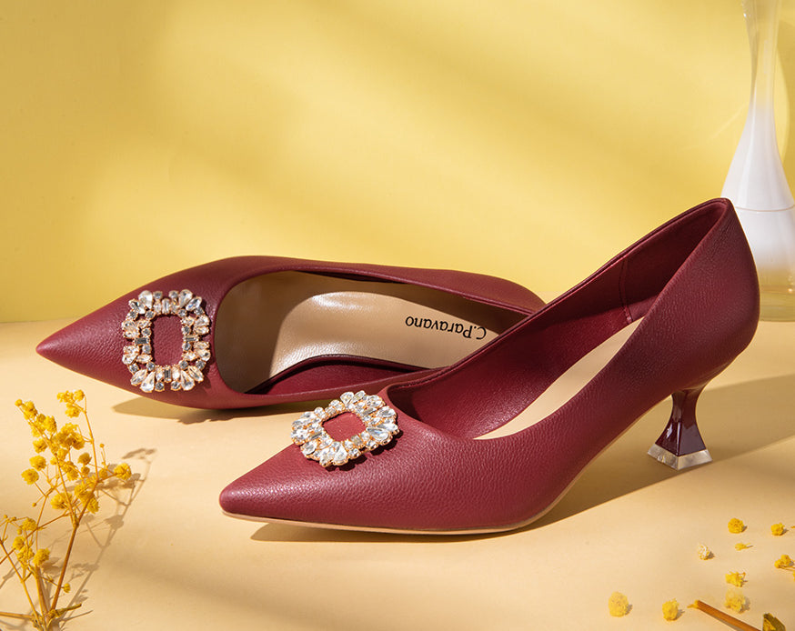 Elegant-red-pumps-crafted-from-leather_-featuring-delicate-embellishments-for-a-touch-of-glamour-and-sophistication