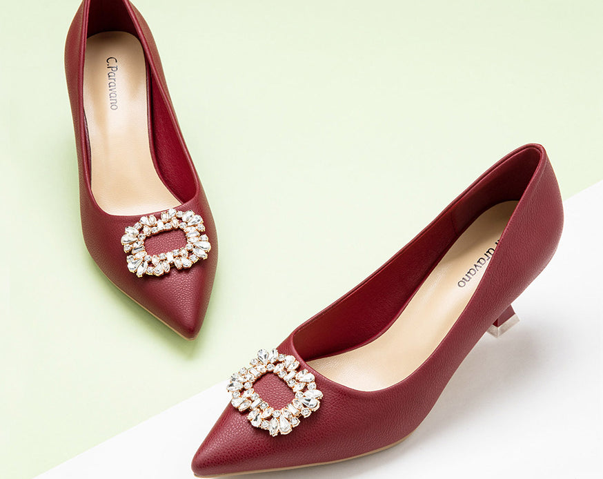 Elegant-red-pumps-crafted-from-leather_-featuring-stunning-embellishments-for-a-sophisticated-and-eye-catching-look