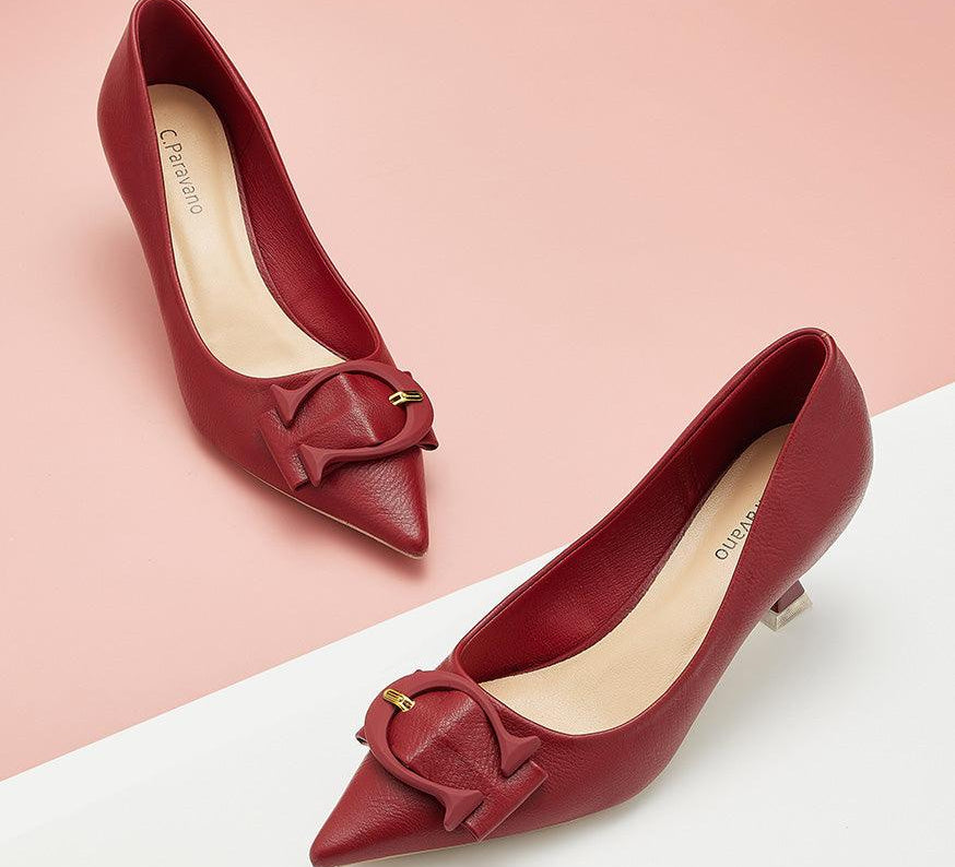 Elegant-red-pumps-with-C-shaped-buckle-detailing_-adding-a-touch-of-sophistication-and-style
