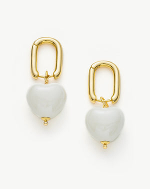      Elegant-white-heart-earrings_-featuring-pristine-white-heart-shaped-pendants