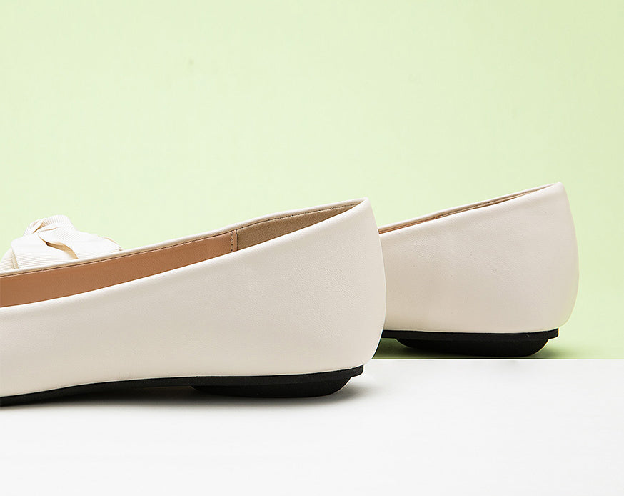 Elegant-whiteleather-point-toeflats-a-stylish-and-polished-choice.