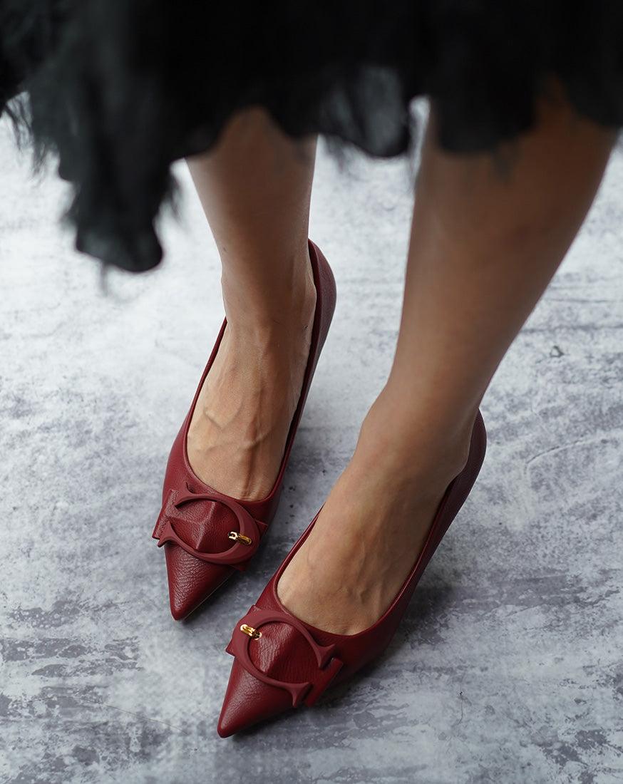 Eye-catching-red-C-buckled-pumps_-exuding-a-sense-of-glamour-and-fashion-forwardness