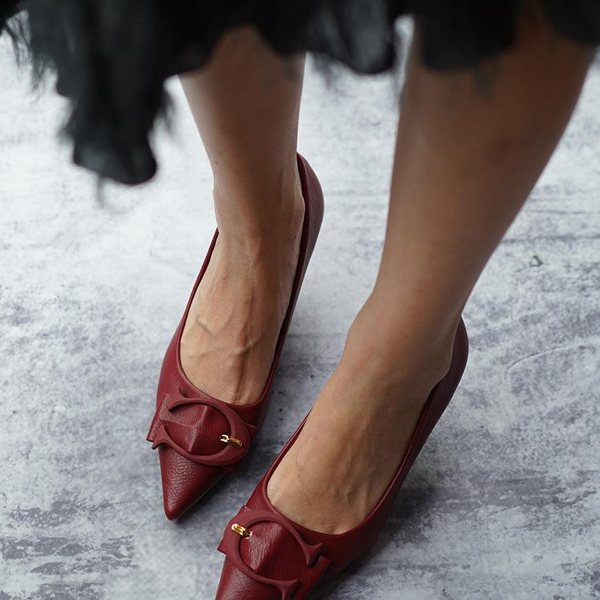 Eye-catching-red-C-buckled-pumps_-exuding-a-sense-of-glamour-and-fashion-forwardness