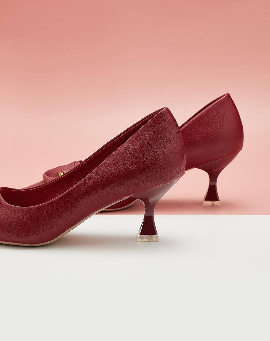 Eye-catching-red-C-buckled-pumps_-exuding-a-sense-of-glamour-and-fashion-forwardness