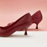 Eye-catching-red-C-buckled-pumps_-exuding-a-sense-of-glamour-and-fashion-forwardness