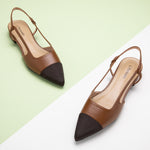 Brown Slingback Flats with a pointed toe, featuring a timeless design for a refined and understated look.