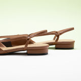 Brown Pointe Toe Flats with a slingback, perfect for a confident and fashionable look in any urban setting