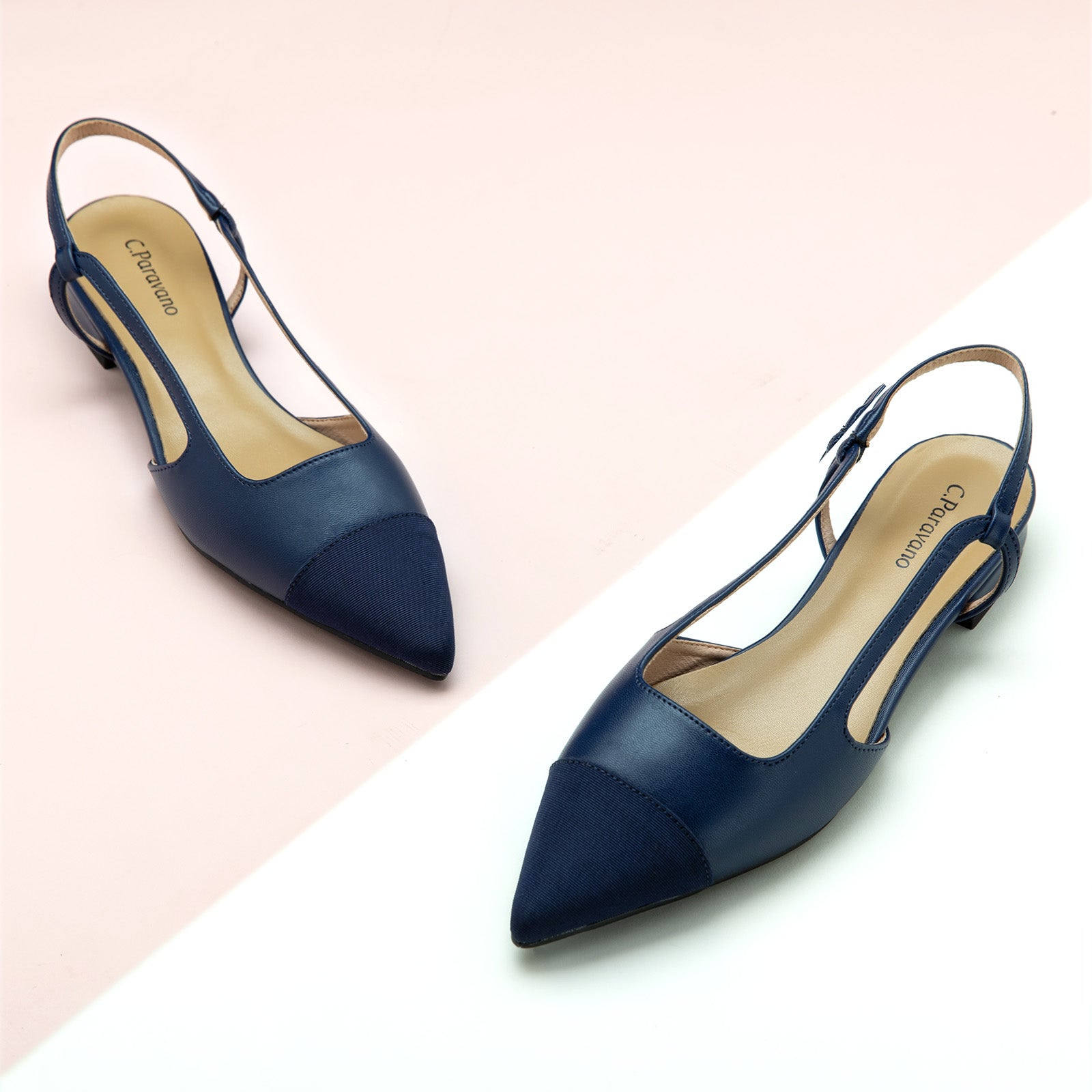Navy Slingback Flats with a pointed toe, perfect for a confident and fashionable look in any urban setting.