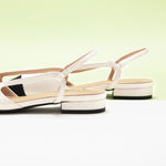 White Slingback Flats with a pointed toe, offering a fresh and modern addition to your footwear collection