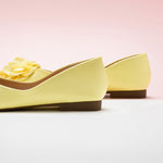 Soft and Subtle: Light Yellow Flower Decor Ballerina, a delightful accent for a cheerful ambiance