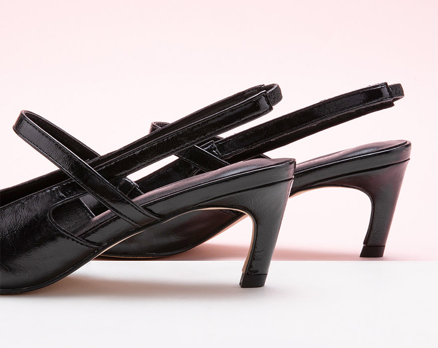 Sleek Black Slingback Pumps: Step out in style with these refined black heels featuring a pointed toe and slingback design.