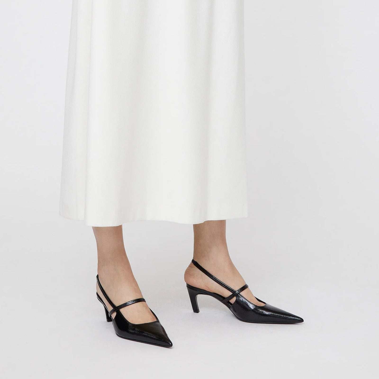 Bold Black Beauty: Sleek Pointed Toe Pumps in Black with straps and slingback,