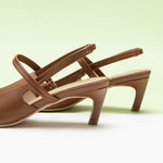 Sleek Brown Slingback Pumps: Step out in style with these refined brown heels featuring a pointed toe and slingback desig