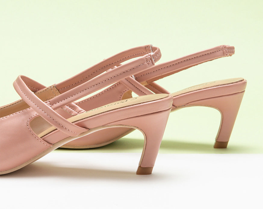 Sleek Pink Slingback Pumps: Step out in style with these refined pink heels featuring a pointed toe and slingback design.