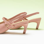 Pink Strappy Slingback Pumps with a pointed toe, featuring delicate details for a polished and sophisticated style