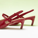 Red Strappy Slingback Pumps with a pointed toe, adding a touch of modernity to your ensemble in a striking hue