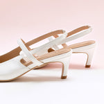 Sleek White Slingback Pumps: Step out in style with these sophisticated white heels featuring a pointed toe and slingback design