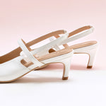 White Strappy Slingback Pumps with a pointed toe, offering a fresh and modern addition to your footwear collection.