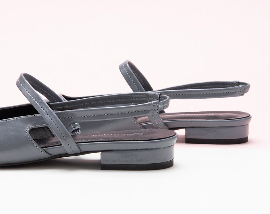 Sleek Grey Slingback Flats: Step out in style with these refined grey flats featuring a pointed toe and slingback design
