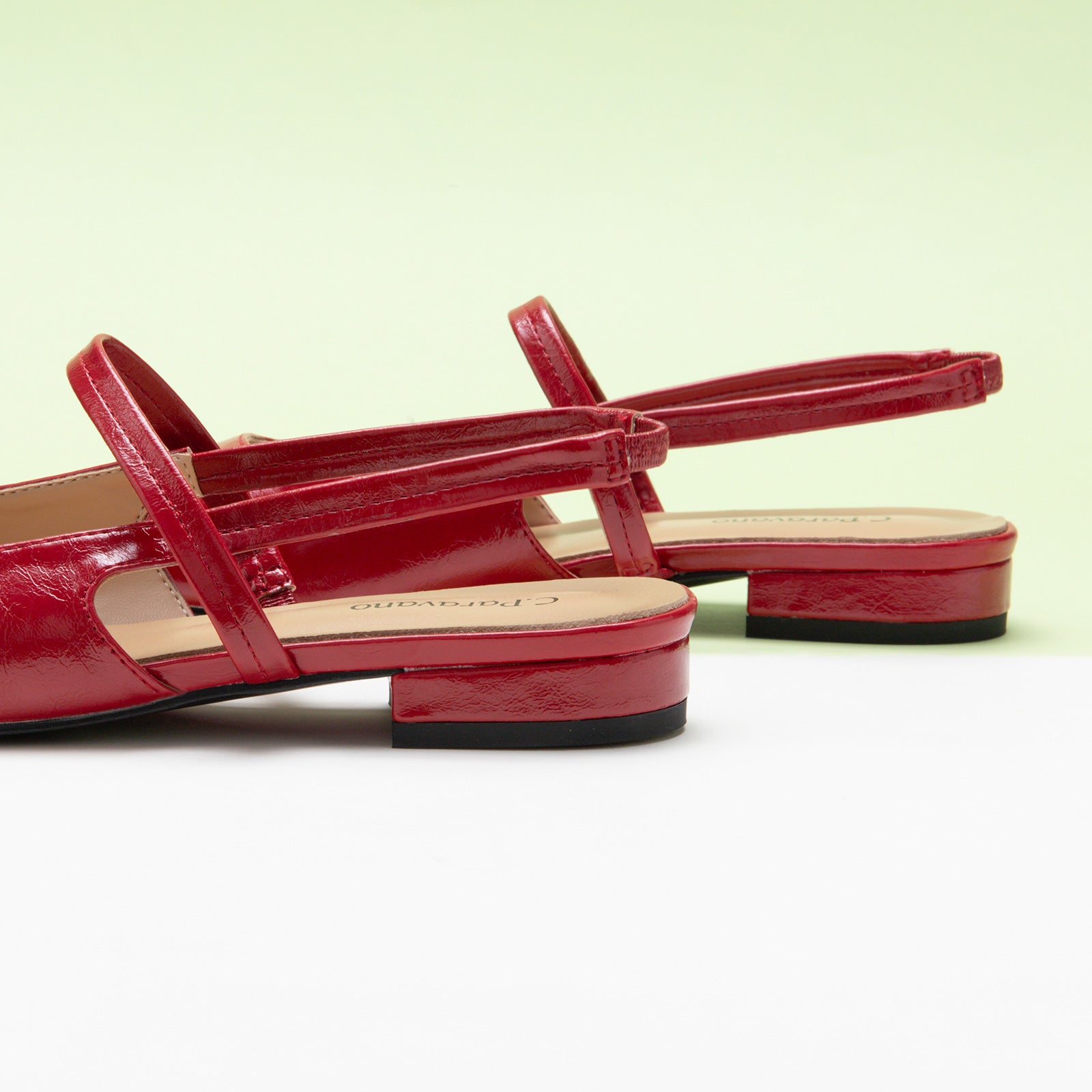Red Strappy Slingback Flats with a pointed toe, adding a touch of modernity to your ensemble in a striking hue