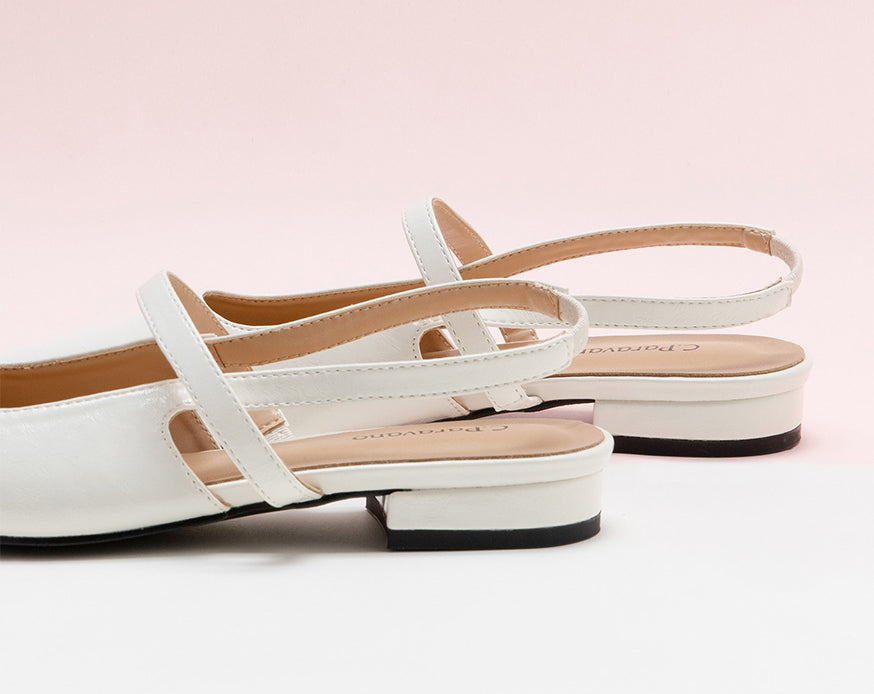 Sleek White Slingback Flats: Step out in style with these refined white flats featuring a pointed toe and slingback design