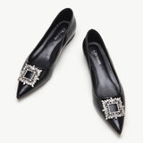 Black leather flats with stylish embellishments for a sophisticated look